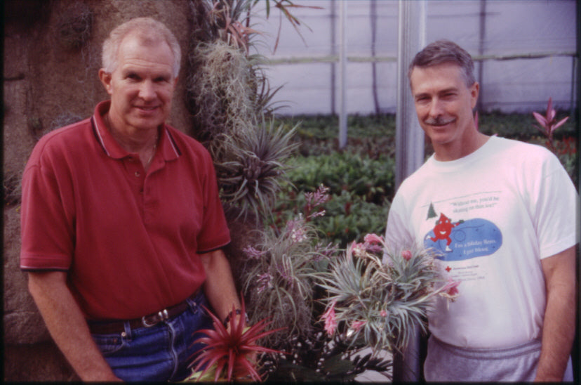 Co-founders Jerry Robinson and Paul Isley holding Tillandsias.